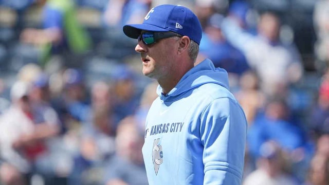 Apr 10, 2025; Kansas City, Missouri, USA; Kansas City Royals manager Matt Quatraro (33) returns to the dugout after a visit to the mound against the Minnesota Twins in the sixth inning at Kauffman Stadium. Mandatory Credit: Denny Medley-Imagn Images