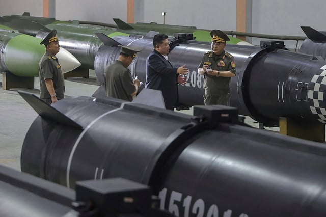 North Korean leader Kim Jong Un inspects a missile production line in an undisclosed location on August 31, 2025.