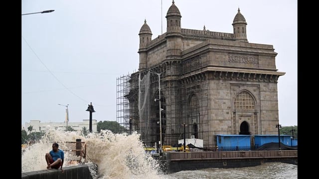 Waves crash over the promenade in front of Gateway of India in Mumbai. (ANI Photo)
