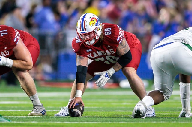 Aug. 29, 2025; Lawrence, Kansas; Kansas football offensive lineman Kael Farkes (58) gets ready for the snap during a game against Wagner at David Booth Kansas Memorial Stadium.