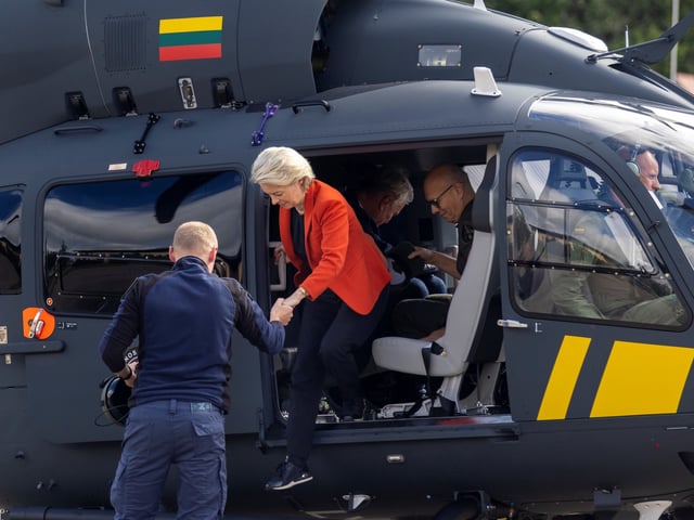 President of the European Commission Ursula von der Leyen gets out of the helicopter after inspecting the Lithuanian-Belarusian border at the Border Guard School near Lithuanian-Belarusian border, near the village Medininkai, some 25 km (16 miles) east of the capital Vilnius, Lithuania, Monday, Sept. 1, 2025. (AP Photo/Mindaugas Kulbis)