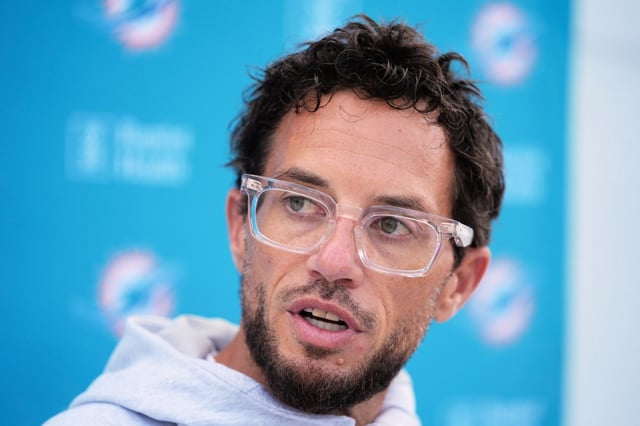 Miami Dolphins head coach Mike McDaniel speaks at a news conference during a joint practice at NFL football training camp with the Detroit Lions, Wednesday, Aug. 13, 2025, in Allen Park, Mich. (AP Photo/Ryan Sun)