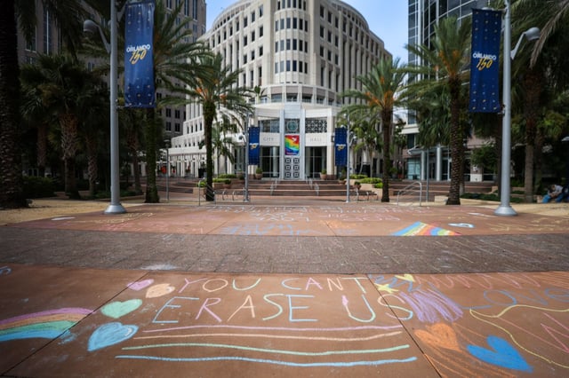 Messages written in chalk in front of Orlando City Hall protest the removal of the painted rainbow crosswalk near Pulse in Orlando. (Rich Pope/Orlando Sentinel)