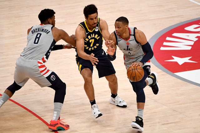 Russell Westbrook #4 of the Washington Wizards dribbles in front of Malcolm Brogdon #7 of the Indiana Pacers during the first half at Capital One Arena on May 20, 2021 in Washington, DC.