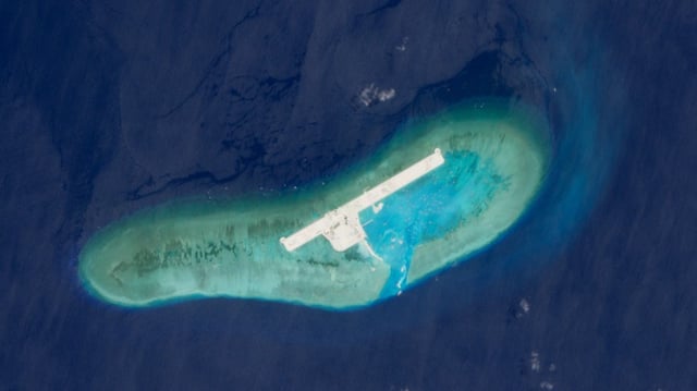 Satellite image of Ladd Reef, a Vietnam-controlled reef in the Spratly group of islands, showing land reclamation structures