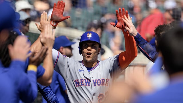Sep 1, 2025; Detroit, Michigan, USA; New York Mets right fielder Juan Soto (22) celebrates in the dugout after hitting a grand slam home run against the Detroit Tigers in the fourth inning at Comerica Park. Mandatory Credit: Lon Horwedel-Imagn Images