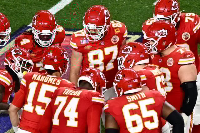 Kansas City Chiefs' tight end #87 Travis Kelce stands with teammates on the field during Super Bowl LVIII between the Kansas City Chiefs and the San Francisco 49ers at Allegiant Stadium in Las Vegas, Nevada, February 11, 2024. (Photo by Patrick T. Fallon / AFP) (Photo by PATRICK T. FALLON/AFP via Getty Images)