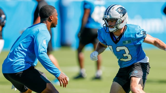 Carolina Panthers wide receiver Hunter Renfrow, right, runs a drill during practice at the team's NFL football training camp in Charlotte.