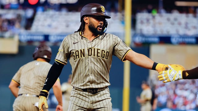 Aug 30, 2025; Minneapolis, Minnesota, USA; San Diego Padres right fielder Fernando Tatis Jr. (23) celebrates his run against the Minnesota Twins in the seventh inning at Target Field. Mandatory Credit: Bruce Kluckhohn-Imagn Images
