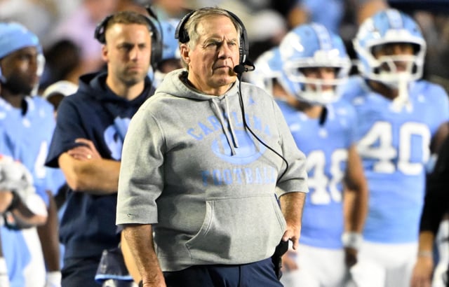 North Carolina football coach Bill Belichick stands on the sidelines during his team's game against TCU at Kenan Stadium.