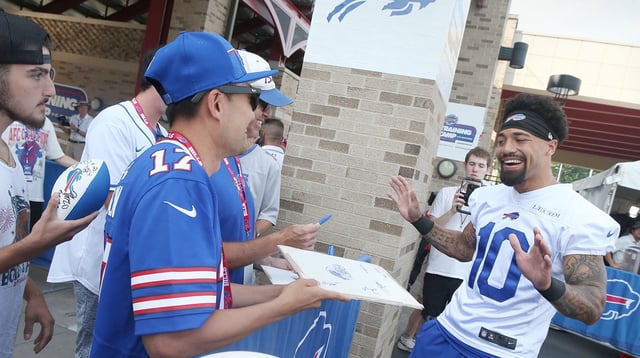 Bills wide receiver Khalil Shakir jokes with fans as he signs autographs during the second day of Buffalo Bills training camp at St. John Fisher University Thursday, July 24, 2025 in Pittsford.