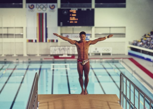 Greg Louganis of the United States prepares to dive in the Men's 10-metre Platform diving competition on 27th September 1988 during the XXIV Olympic Summer Games at the Jamsil Indoor Swimming Pool in Seoul, South Korea. (Photo by Pascal Rondeau/Allsport/Getty Images)