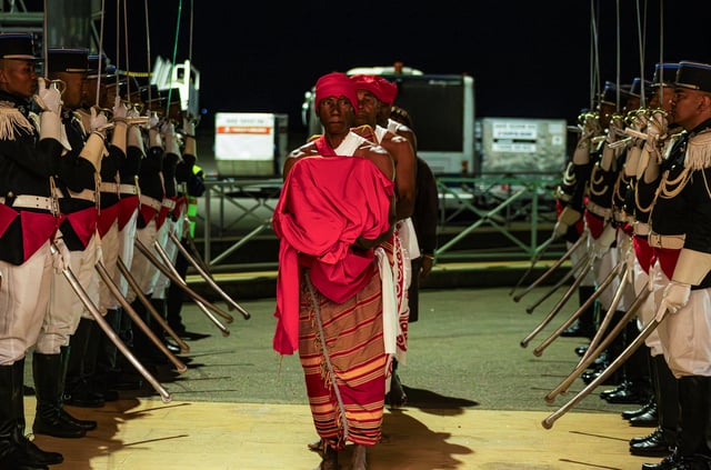 Traditional representatives attend the welcoming ritual of the three colonial-era skulls, including one believed to be that of a Malagasy king killed by French troop, that were held in a Paris museum and returned to Madagascar 128 years after they were taken to France, at Ivato International Airport, near Antananarivo, Madagascar, September 1, 2025. REUTERS/Zo Andrianjafy