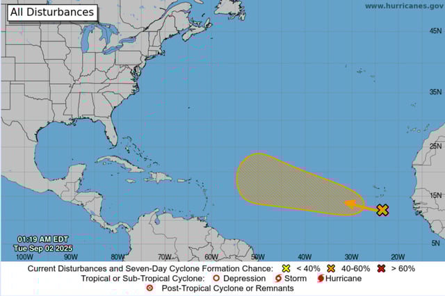 An NHC graphic highlights the disturbance in orange.