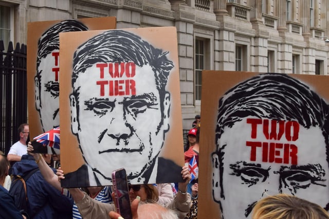 Protesters hold signs outside Downing Street referring to Keir Starmer as 'Two Tier' in reference to fa-right claims that white British people are disadvantaged in the UK. Photo: Vuk Valcic/Alamy Live News