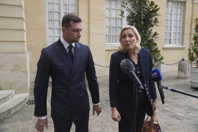 French far right leader Marine Le Pen, right, and Rassemblement National party president Jordan Bardella speak to the media following a meeting with French Prime Minister Francois Bayrou before a confidence vote, at the Hotel Matignon in Paris Tuesday, Sept. 2, 2025. (AP Photo/Thibault Camus)