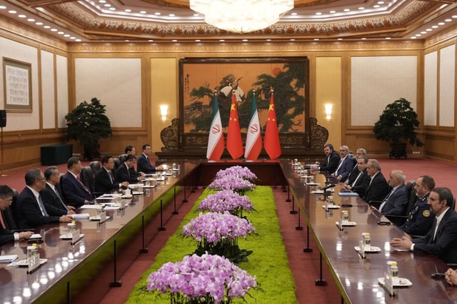Chinese President Xi Jinping, fourth left, speaks with Iranian President Masoud Pezeshkian, fourth right, at the Great Hall of the People in Beijing, China, Tuesday, Sept. 2, 2025.