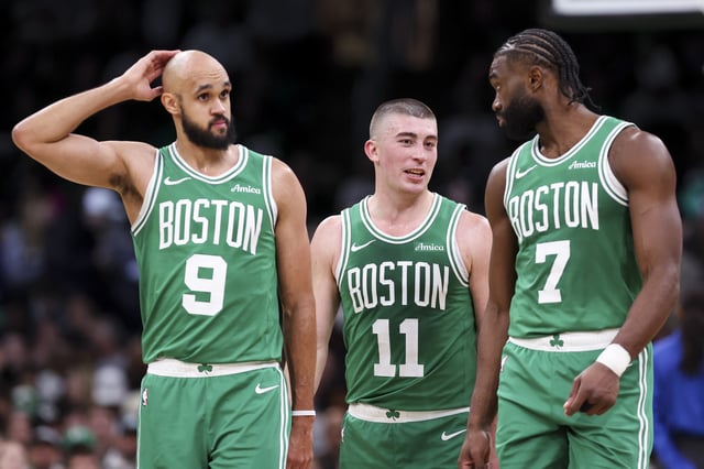 BOSTON, MA - DECEMBER 12: Derrick White #9 of the Boston Celtics, Payton Pritchard #11 of the Boston Celtics, Jaylen Brown #7 of the Boston Celtics react during a game against the Detroit Pistons at TD Garden on December 12, 2024 in Boston, Massachusetts. NOTE TO USER: User expressly acknowledges and agrees that, by downloading and or using this photograph, User is consenting to the terms and conditions of the Getty Images License Agreement. (Photo by Adam Glanzman/Getty Images)