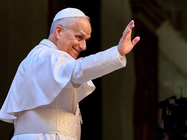 Pope Leo XIV waves upon his arrival at the St. Augustin Basilica in Rome, Monday, Sept. 1, 2025, to address his fellow Augustinians at the start of their global assembly. (AP Photo/Domenico Stinellis)