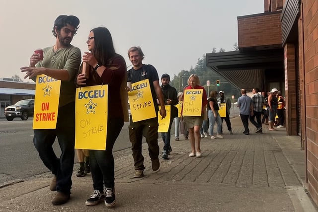 Members of the BC General Employees Union walk the picket line on Queensway outside the BC government building on the first day of their strike on Tuesday, Sept. 2, 2025 in Prince George, BC.