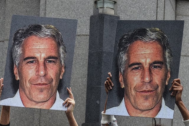 Protesters hold posters of Jeffrey Epstein in front of the Federal courthouse on July 8, 2019 in New York City.