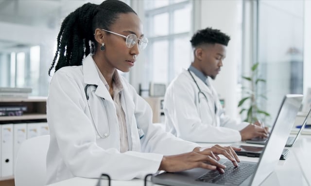 doctors on laptops