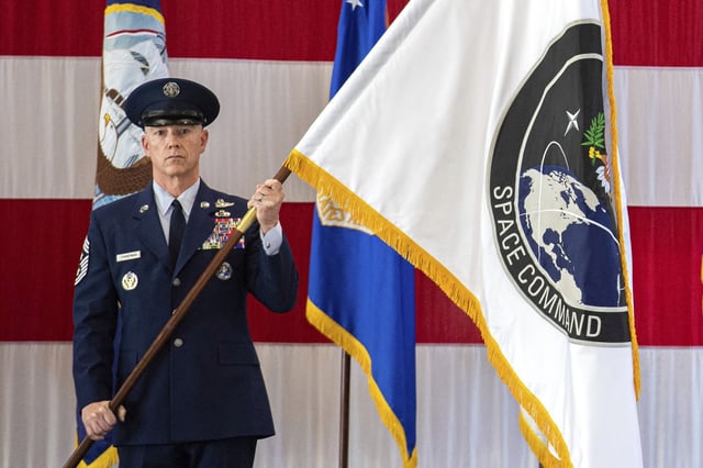FILE – A presentation of the U.S. Space Command colors, Sept. 9, 2019, during a ceremony to recognize the establishment of the United States Space Command at Peterson Air Force Base in Colorado Springs, Colo. (Christian Murdock/The Gazette via AP, File)