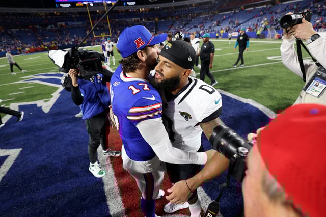 ORCHARD PARK, NEW YORK - SEPTEMBER 23: Josh Allen #17 of the Buffalo Bills and Gabe Davis #0 of the Jacksonville Jaguars embrace after a game at Highmark Stadium on September 23, 2024 in Orchard Park, New York.