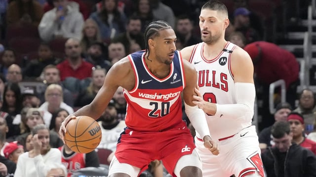 Chicago Bulls center Nikola Vucevic (9) defends Washington Wizards forward Alex Sarr (20) during the first quarter at United Center