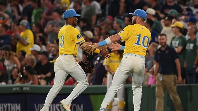 Jul 26, 2025; Boston, Massachusetts, USA; Boston Red Sox shortstop Trevor Story (10) congratulates center fielder Ceddanne Rafaela (3) for an assist on a throw to second base ending the top of the seventh inning against the Los Angeles Dodgers at Fenway Park. Mandatory Credit: Bob DeChiara-Imagn Images