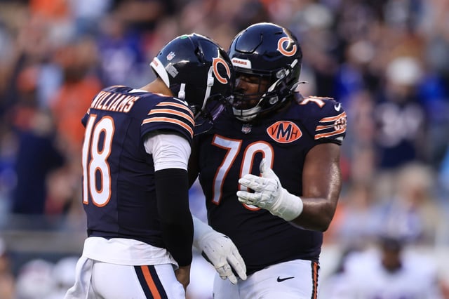Caleb Williams #18 of the Chicago Bears celebrates a touchdown with Braxton Jones #70 of the Chicago Bears during the NFL Preseason 2025 game between the Buffalo Bills and the Chicago Bears at Soldier Field on Aug. 17, 2025 in Chicago, Illinois. (Photo by Geoff Stellfox/Getty Images)