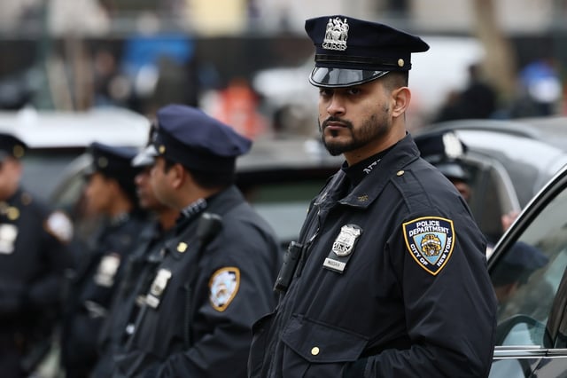 NYPD officers stand guard as people gather outside of a New York court to protest the arrest and detention of Mahmoud Khalil at Foley Square on March 12, 2025 in New York City. (Photo by Michael M. Santiago/Getty Images)