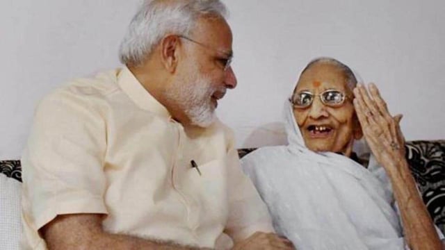 File photo of Prime Minister Narendra Modi spending time with his mother on his birthday at her Gandhinagar residence. (PTI)