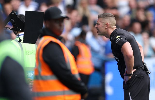 Soccer Football - Premier League - Chelsea v Fulham - Stamford Bridge, London, Britain - August 30, 2025 Referee Robert Jones looks at a VAR screen before disallowing a Fulham's Josh King goal Action Images via Reuters/John Sibley/File Photo