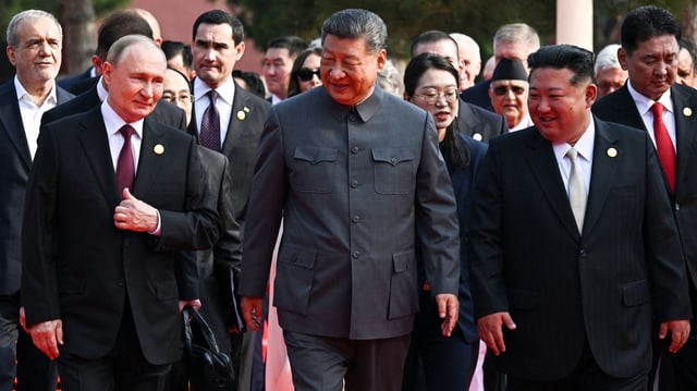 Putin, Xi and KIm (L-R) at the parade in Beijing. Photo: Sergey Bobylev/pool via Getty