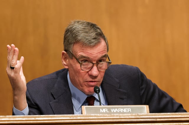 U.S. Senator Mark Warner (D-VA) speaks on Capitol Hill in Washington, D.C., U.S., April 10, 2025. REUTERS/Kevin Mohatt/File Phto