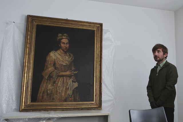 Giuseppe Ghislandi's 18th-century painting "Portrait of a Lady," reportedly stolen by a Nazi officer during World War II and discovered in the home of his daughter after appearing in a real estate listing, is displayed during a press conference by Prosecutor Daniel Adler in Mar del Plata, Argentina, Wednesday, Sept. 3, 2025. (AP Photo/Christian Heit)
