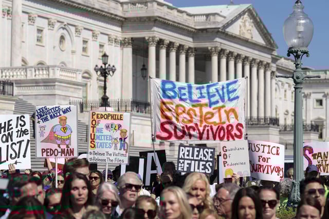 Demonstrators hold banners during a news conference at the U.S. Capitol, Wednesday, Sept. 3, 2025, in Washington. (AP Photo/Jose Luis Magana)