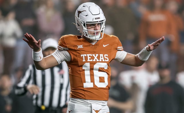 Arch Manning #16 of the Texas Longhorns motions to quiet the crowd in the fourth quarter against the Texas Tech Red Raiders at Darrell K Royal-Texas Memorial Stadium on November 24, 2023 in Austin, Texas.