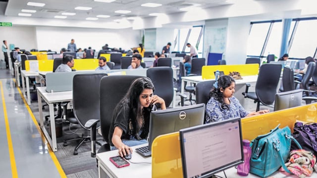 Tiny Owl employees work at computers inside the company's head office in Mumbai, India, on Monday, March. 9, 2015. Tiny Owl is a smartphone application that helps hungry city-dwellers scour nearby eateries for deliveries. The service now handles 2,000 orders each day and has caught the interest of venture funds including Sequoia Capital, an early backer of technology giants such as Apple Inc. and Oracle Corp. Photographer: Dhiraj Singh/Bloomberg (Bloomberg)