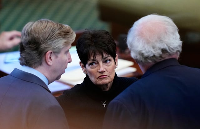 Texas state Sen. Donna Campbell, R-New Braunfels, center, talks with Sen. Tan Parker, R-Flower Mound, left, and Sen. Paul Bettencourt, R-Houston, right, as the senate prepares to debate a bill that would add new abortion restrictions, Wednesday, Sept. 3, 2025, in Austin, Texas. (AP Photo/Eric Gay)