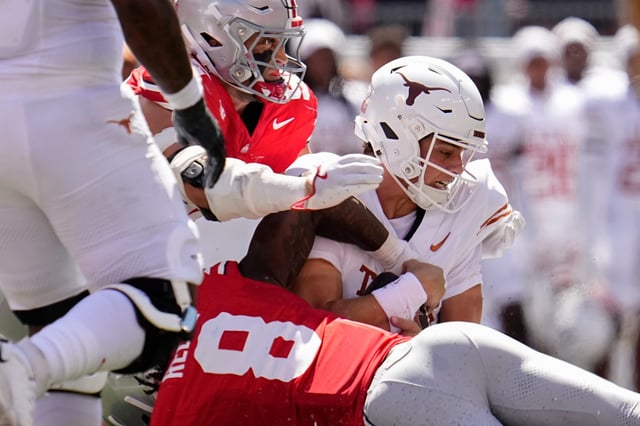 Ohio State Buckeyes linebacker Arvell Reese (8) tackles Texas Longhorns quarterback Arch Manning (16) during the first half of the NCAA football game at Ohio Stadium on Aug. 30, 2025. © Adam Cairns/Columbus Dispatch / USA TODAY NETWORK via Imagn Images