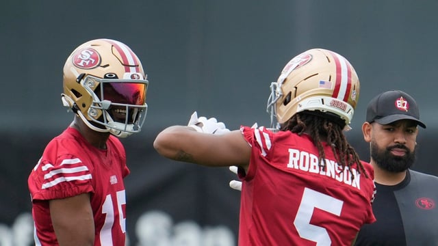 San Francisco 49ers wide receiver Jauan Jennings (15) talks with wide receiver Demarcus Robinson (5) 