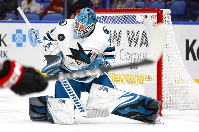 San Jose Sharks goaltender Aaron Dell (30) makes a save during the first period of an NHL hockey game against the Buffalo Sabres, Sunday, Dec. 4, 2022, in Buffalo, N.Y. (AP Photo/Jeffrey T. Barnes)