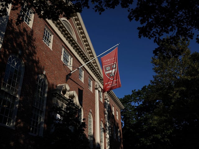A flag hangs on campus at Harvard University in Cambridge, Massachusetts, U.S., September 4, 2025. REUTERS/Shannon Stapleton