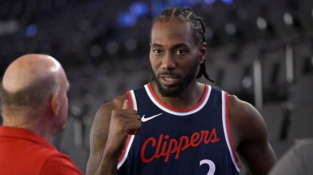 Clippers forward Kawhi Leonard (2) talks with team owner Steve Ballmer during media day at Intuit Dome
