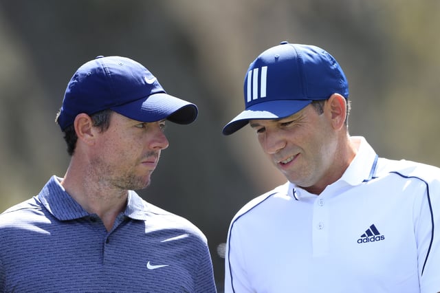 PONTE VEDRA BEACH, FLORIDA - MARCH 11: Rory McIlroy of Northern Ireland talks to Sergio Garcia of Spain during the first round of THE PLAYERS Championship on THE PLAYERS Stadium Course at TPC Sawgrass on March 11, 2021 in Ponte Vedra Beach, Florida. (Photo by Sam Greenwood/Getty Images)