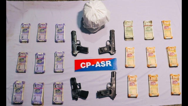 Heroin, weapons and drug money seized by Amritsar police. (HT Photo)