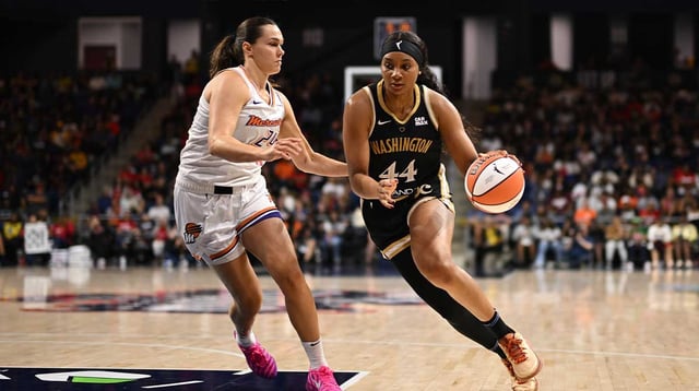 Sep 4, 2025; Washington, District of Columbia, USA; Washington Mystics forward Kiki Iriafen (44) attempts to dribble past Phoenix Mercury forward Kathryn Westbeld (24) during the third quarter at CareFirst Arena. Mandatory Credit: Rafael Suanes-Imagn Images