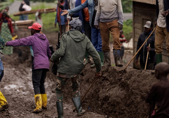 An M23 rebel walks on a muddy road on the outskirts of Rubaya, which is controlled by M23 rebels, in eastern Democratic Republic of Congo, March 24, 2025. REUTERS/Zohra Bensemra/File Photo